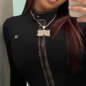 Louis Vuitton body suit worn once for 2 hours